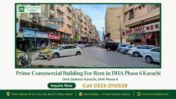Street view of a prime commercial building in DHA Phase 6 Karachi surrounded by parked cars and shops.