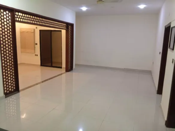 Spacious Living Area With Ornate Wooden Lattice Archway, Glossy White Tiled Floors In Luxury 3-Bedroom Portion For Rent In Pe