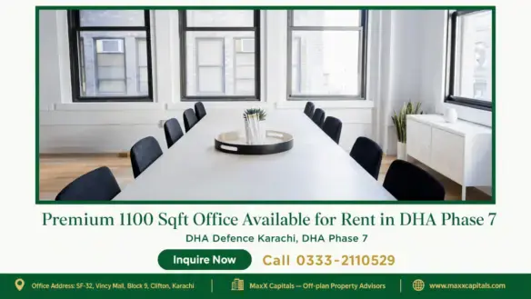 Modern office space with a large rectangular conference table, black chairs, wooden flooring, and natural lighting through wi