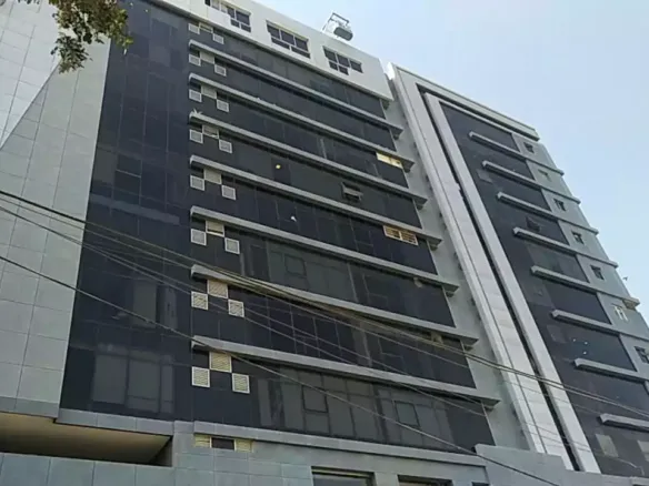 Multi-Story Luxury Office Building Facade In Clifton Diamond, Featuring Tinted Glass Windows, White Panels, And Modern Design