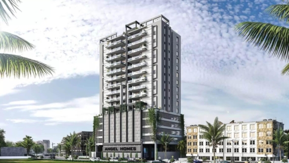 Modern Multi-Story Angel Homes Residential Tower With Glass Balconies, Green Base, Palm Trees, And Urban Surroundings