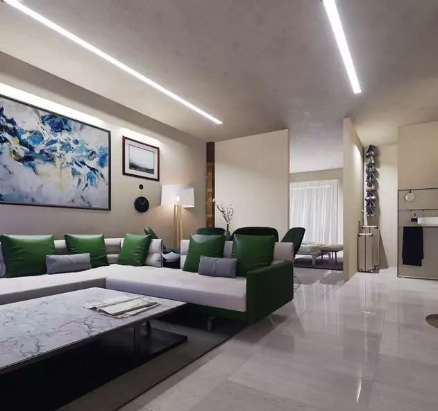 The Nishat Residency Dha Phase 6 Defence Karachi (10) Spacious living room in Nishat Residency luxury 3-bed apartment, DHA Phase 6 Karachi, green L-shaped sofa, abstract blue art,