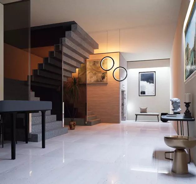 The Nishat Residency Dha Phase 6 Defence Karachi (7) Elegant foyer with grand curved staircase, hanging ring lights, artwork, plants, console table, and marble floors in Nishat R