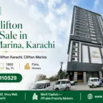 Modern High-Rise Building Facade In Clifton Marina, Karachi, Featuring Sleek Architectural Design And Multi-Floor Layout.