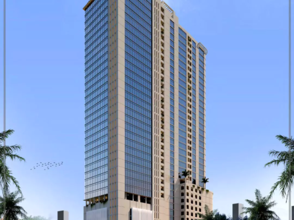 Modern High-Rise Creek Tower Office Building In Dha Phase 7 Karachi, Featuring Glass Facade, Beige Cladding, Palm Trees, And 