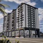 Sumsum Grand 2 Executive Towers Exterior With Sleek Black And White Facade, Multiple Balconies, Ground-Floor Glass Retail Spa