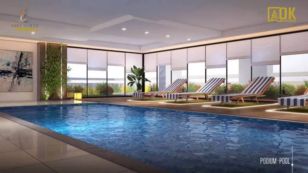 Sawera 5 Sky Tower Clifton Karachi Luxury 3 & 4-Bed Apartments with Pool & 4-Year Installment Plan (3) MaxX Capitals podium pool with lounge chairs at Sawera 5 Sky Tower, Clifton luxury apartments