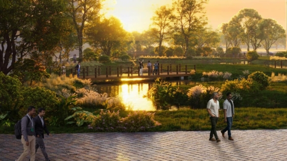 Modern Curved Towers Of Lagoon Views Tower 1 With Lush Green Lawns, Tree-Lined Paths, Flower Beds, And Families Walking Outdo