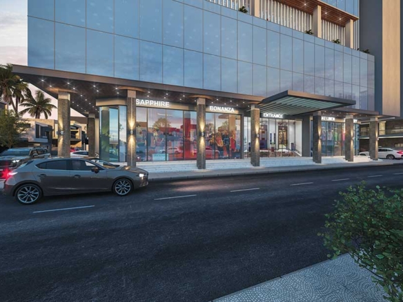 Modern glass facade of luxury office in SM House Prime North Nazimabad with Sapphire signage, entrance canopy, street parking