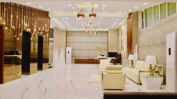 Luxurious Lobby With Marble Floors Gold Elevators White Leather Seating In Penthouse Clifton Block 7 Karachi