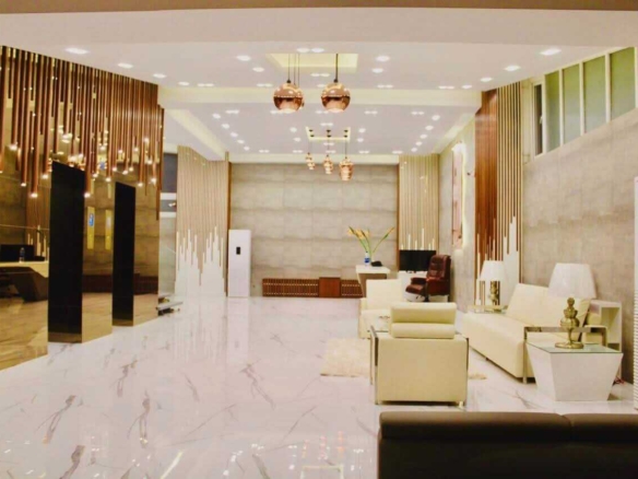 Luxurious Lobby With Marble Floors Gold Elevators White Leather Seating In Penthouse Clifton Block 7 Karachi