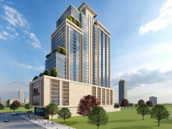 Modern High-Rise Office Tower In Balad Trade Centre With Glass Facade, Green Terraces, Stone Base, And Landscaped Grounds Wit