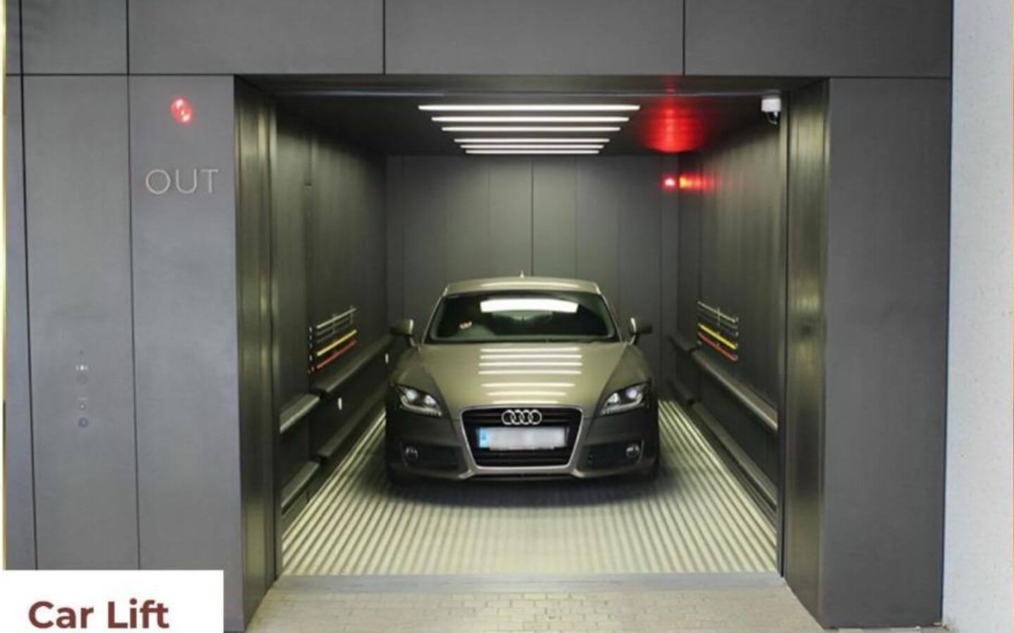 Mehran Sky Tower Luxury Living in Civil Lines, Karachi (4) Open car elevator in Mehran Sky Tower, Civil Lines, Karachi, with silver Audi parked inside on ribbed floor