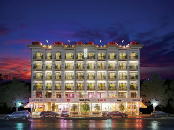 Multi-story residential building in Sky Hills Islamabad at dusk with lit balconies, glass windows, ground floor shops, parked