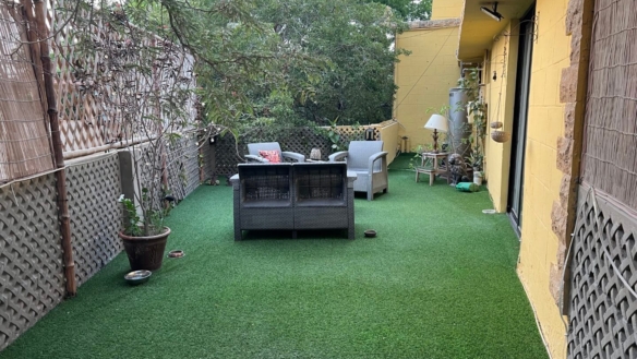 Fully Furnished Outdoor Terrace With Artificial Grass Lawn, Grey Sofa Set, Potted Plants, Bamboo Fencing In Portion For Rent 