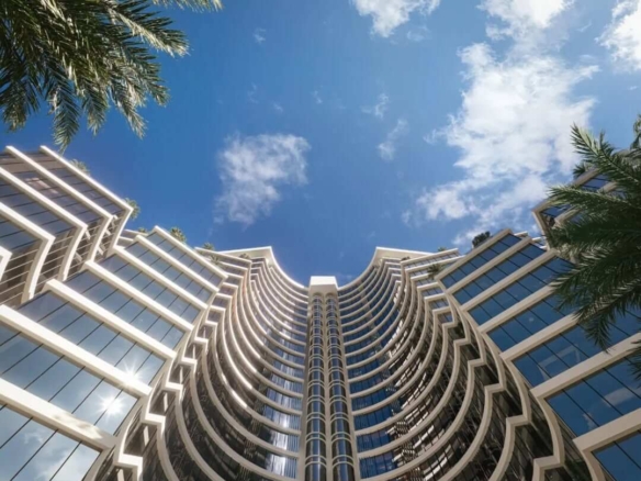 Saima Corporate Tower curved glass facade high-rise with palm trees and blue sky