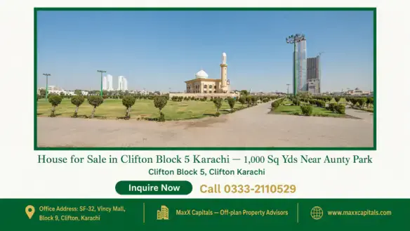 Spacious landscaped park with paved walkways, mosque, and high-rise buildings in Clifton Block 5 Karachi.