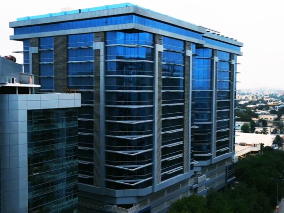 Modern Blue Glass Facade Of Fortune Towers Premium Corner Office Space On Shahrah E Faisal, Multi-Story Towers With City Surr