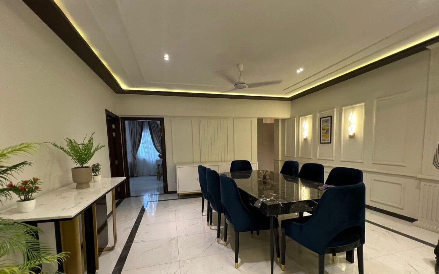 4-Bed Apartment for Sale in Greens 3 Clifton Block 8 MaxX Capitals dining room in 4 bed apartment for sale Greens 3 Clifton with marble table and blue velvet chairs