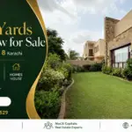 Landscaped 1000 Yards Bungalow Exterior In Dha Phase 8 Karachi With Lawn, Stone Facade, And Balcony