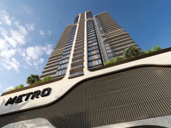 MaxX Capitals Metro Livings Clifton high-rise apartment tower with curved balconies in Karachi