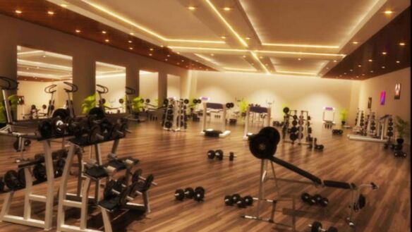 Spacious modern fitness center with premium workout equipment and ambient lighting at ONE VICTORIA Karachi.