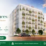 The Nishat Residences White Facade With Arched Balconies, Vertical Detailing And Evening Lighting In Gulberg Lahore
